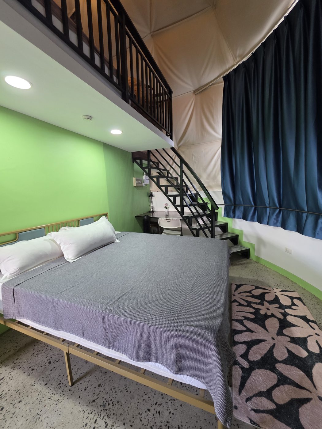 Inside a Dome Pearl Villa, ground floor bed and mezzanine stair