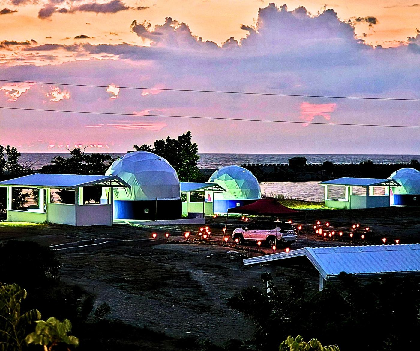 Dome Pearl Villa glowing at night beneath the Milky Way, with private pool