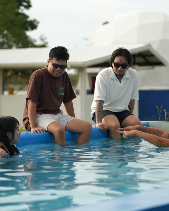 Friends relaxing around the private pool at AmanDagat
