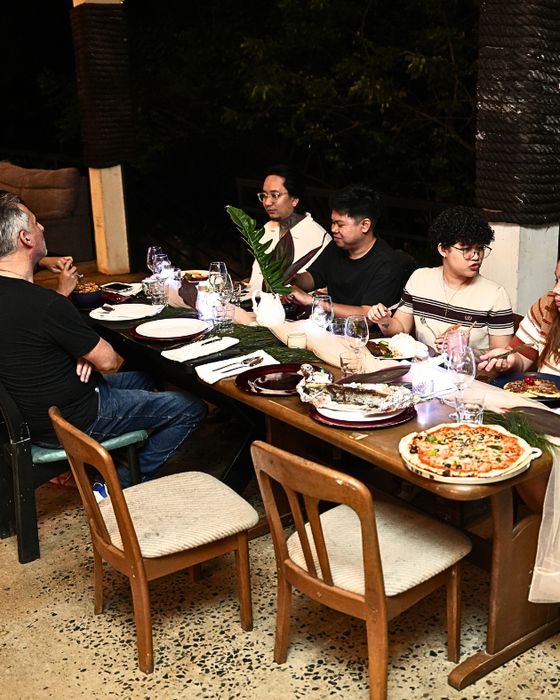 Guests sharing dinner at A’Züla