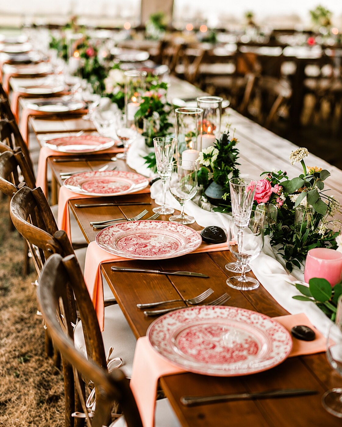 An elegant reception table set with candles and flowers