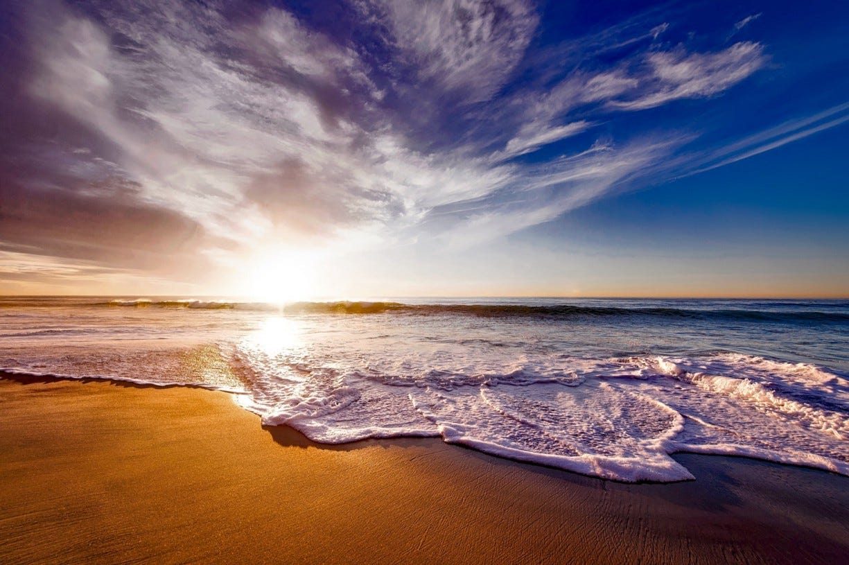 Waves rolling onto golden sand &mdash; peace, by the sea at AmanDagat