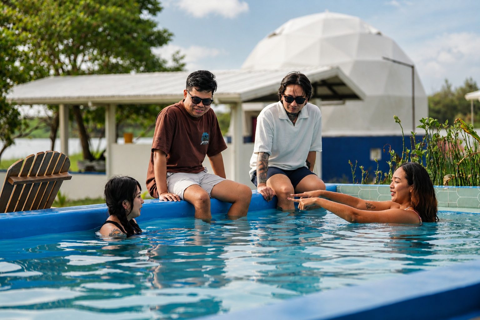 Friends relaxing in the private pool, dome behind