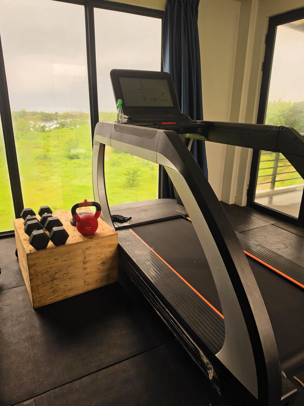 Treadmill and free weights in the gym with lagoon and sea views at AmanDagat Beach Resort