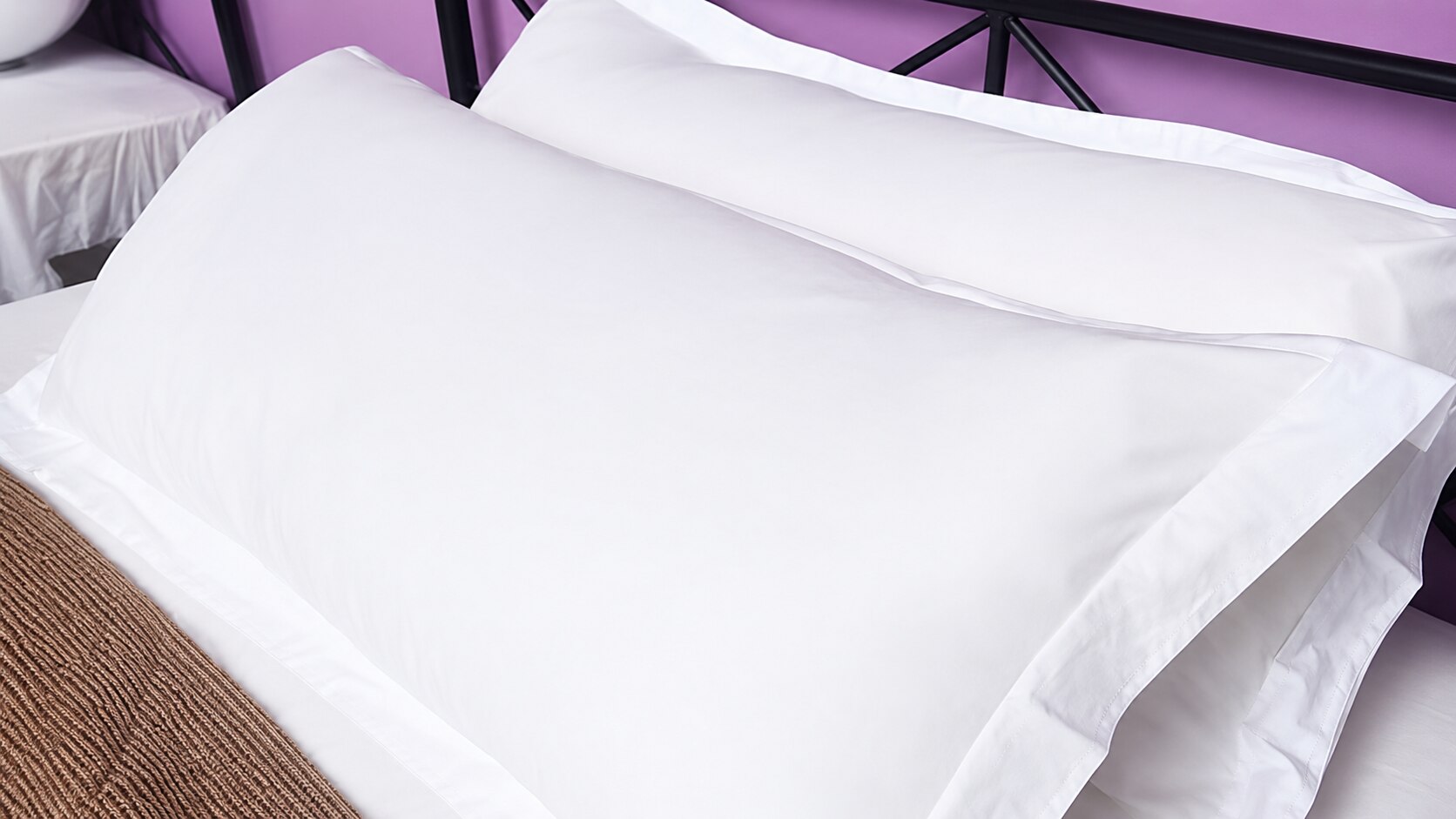 Crisp white pillows on the bed at AmanDagat