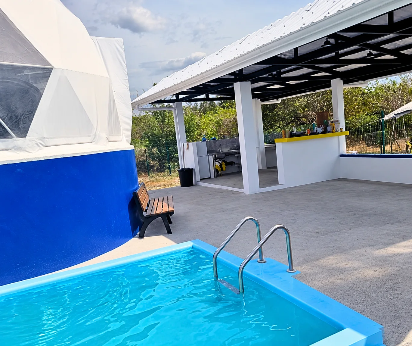 Private villa pool beside the covered kitchen and terrace
