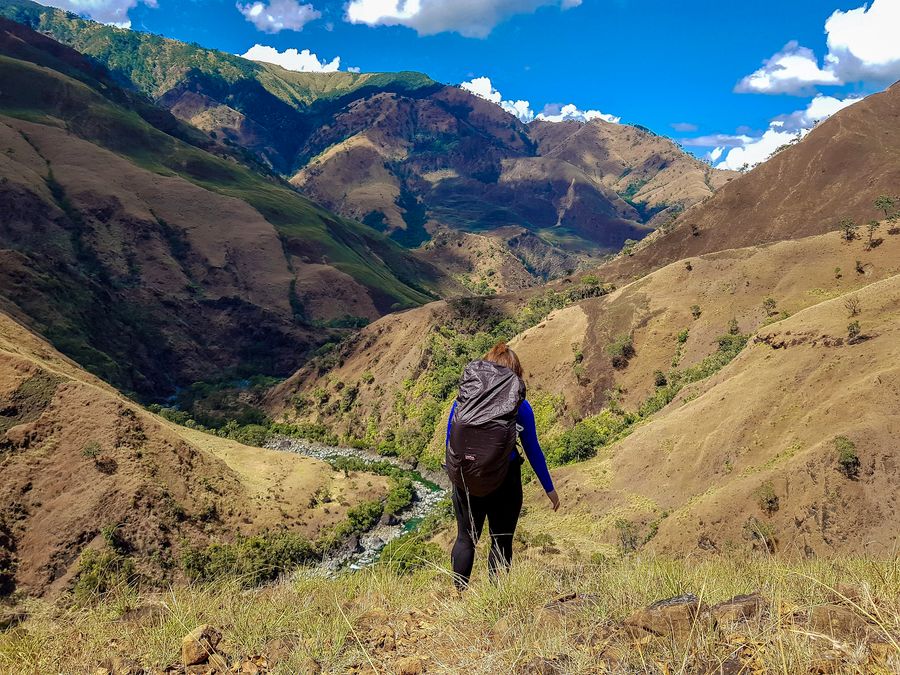 A hiker overlooking the Zambales mountains