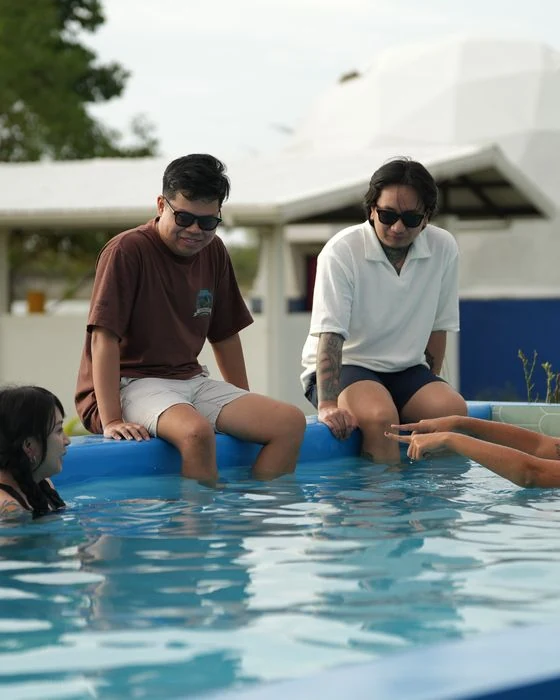 Friends spending time by a private villa pool