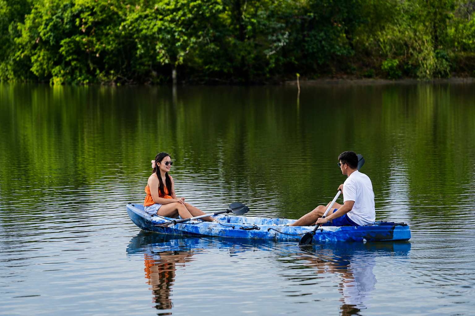 Two guests kayaking on calm water at AmanDagat